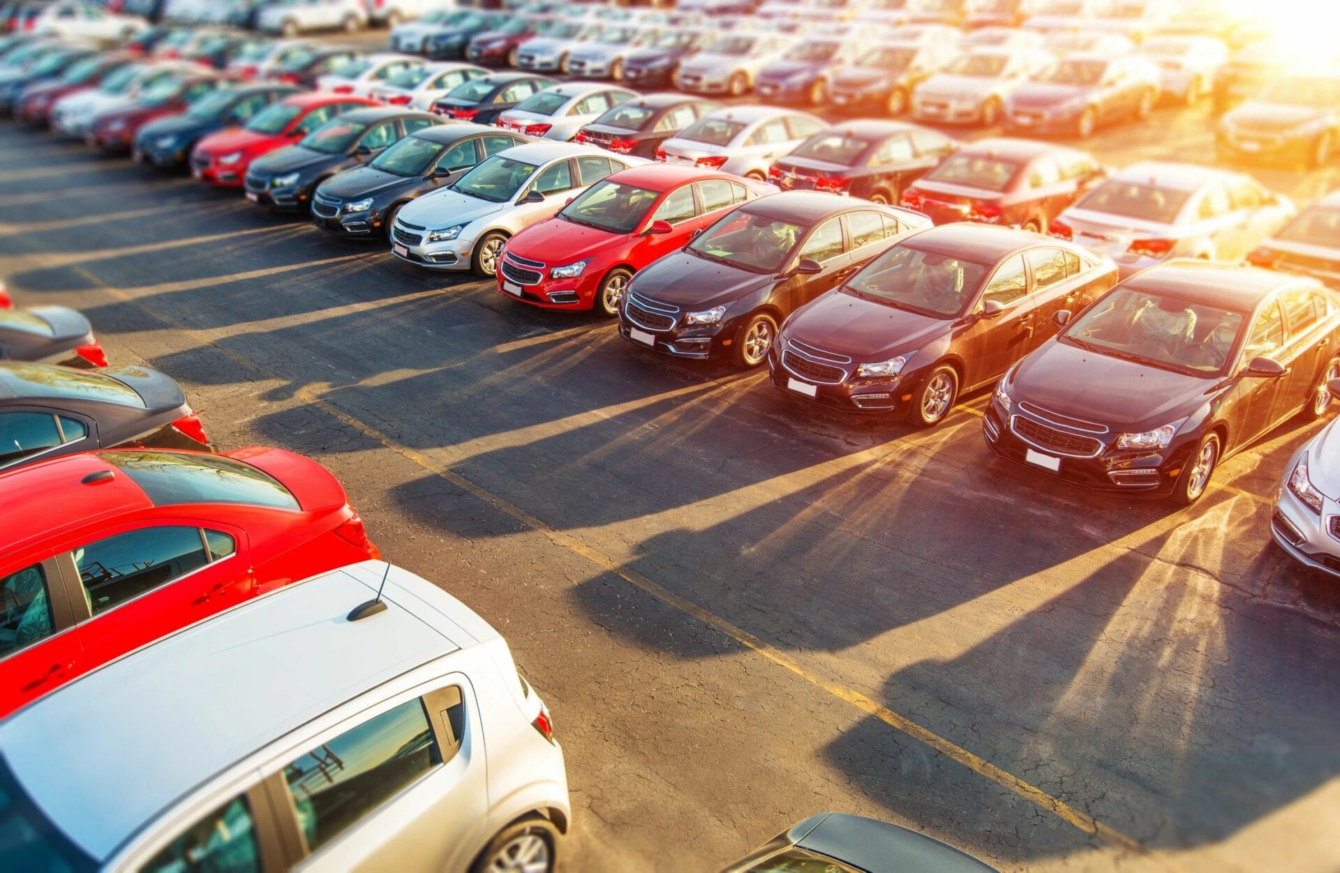 A row of cars in a lot